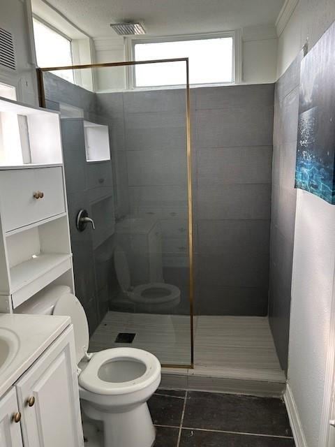 2310 Carlie St, Franklinton, LA 70438 - bathroom with tile patterned floors, a shower stall, vanity, and healthy amount of natural light