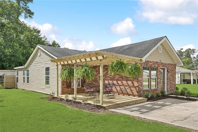 128 Marilyn Dr, Slidell, LA 70461 - exterior space featuring a pergola, brick siding, a patio, and roof with shingles