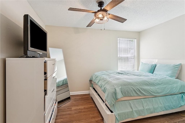 128 Marilyn Dr, Slidell, LA 70461 - bedroom featuring a textured ceiling, wood finished floors, and a ceiling fan