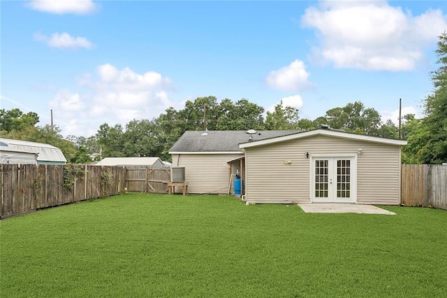 128 Marilyn Dr, Slidell, LA 70461 - rear view of house featuring french doors, a fenced backyard, and a patio
