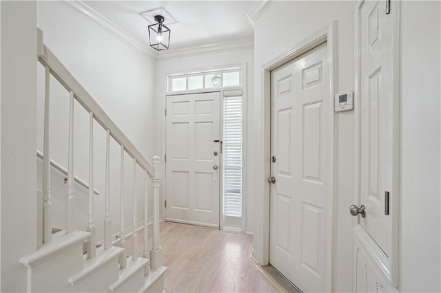 505 Rose St, Metairie, LA 70005 - foyer with crown molding, light wood-style floors, and stairs