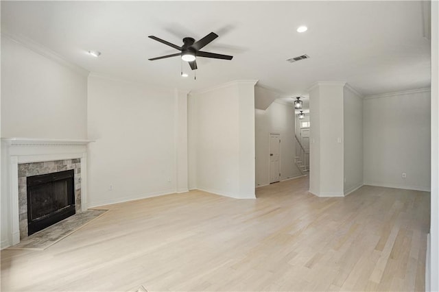 505 Rose St, Metairie, LA 70005 - unfurnished living room featuring ceiling fan, a tiled fireplace, light wood finished floors, recessed lighting, and ornamental molding