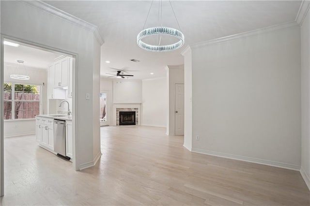 505 Rose St, Metairie, LA 70005 - corridor with light wood finished floors, ornamental molding, and a chandelier