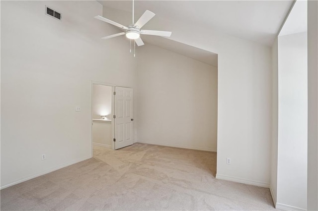 505 Rose St, Metairie, LA 70005 - empty room with a ceiling fan, light colored carpet, and high vaulted ceiling