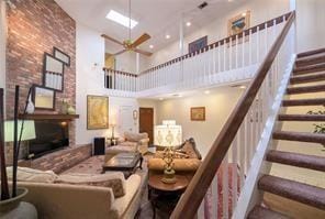 4433-35 Carondelet St, New Orleans, LA 70115 - building lobby featuring a high ceiling, stairs, and recessed lighting