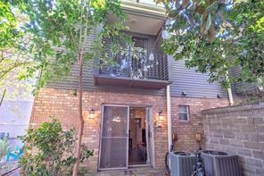 4433-35 Carondelet St, New Orleans, LA 70115 - rear view of house featuring brick siding