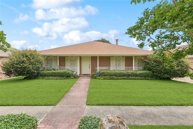 632 Brouilly Dr, Kenner, LA 70065 - ranch-style house with covered porch and a front yard