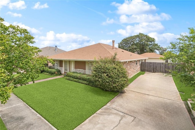 632 Brouilly Dr, Kenner, LA 70065 - ranch-style home featuring concrete driveway and covered porch