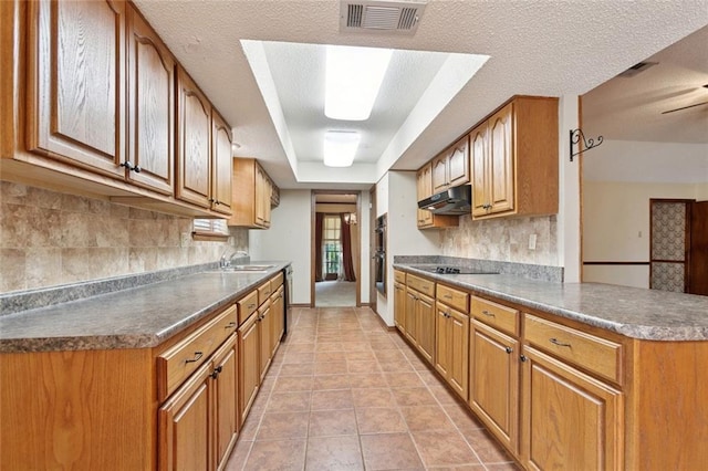 632 Brouilly Dr, Kenner, LA 70065 - kitchen with decorative backsplash, stainless steel appliances, a peninsula, brown cabinets, and light tile patterned floors