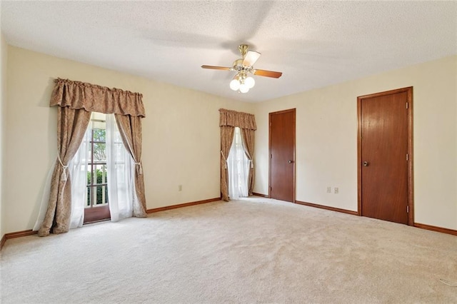 632 Brouilly Dr, Kenner, LA 70065 - unfurnished bedroom featuring access to exterior, light colored carpet, a textured ceiling, and ceiling fan