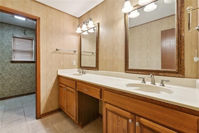 632 Brouilly Dr, Kenner, LA 70065 - bathroom featuring wallpapered walls, double vanity, crown molding, and tile patterned floors