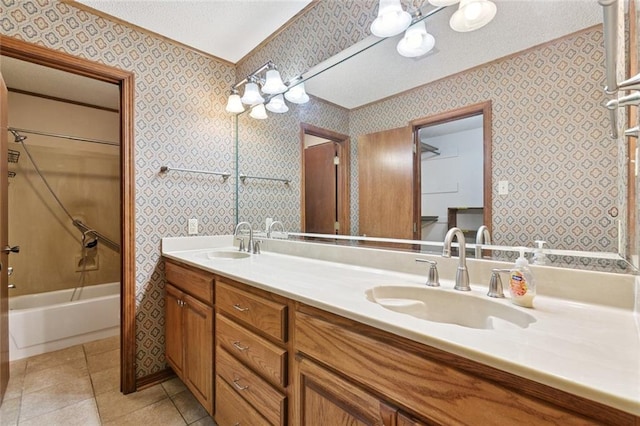 632 Brouilly Dr, Kenner, LA 70065 - bathroom with wallpapered walls, ornamental molding, double vanity, tile patterned flooring, and shower / bathtub combination
