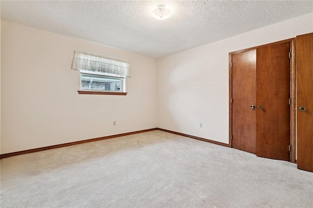 632 Brouilly Dr, Kenner, LA 70065 - unfurnished bedroom featuring carpet, a textured ceiling, and a closet