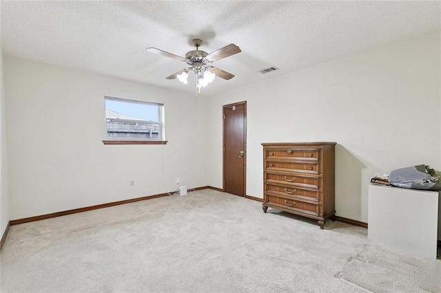 632 Brouilly Dr, Kenner, LA 70065 - bedroom with light colored carpet, a textured ceiling, and a ceiling fan