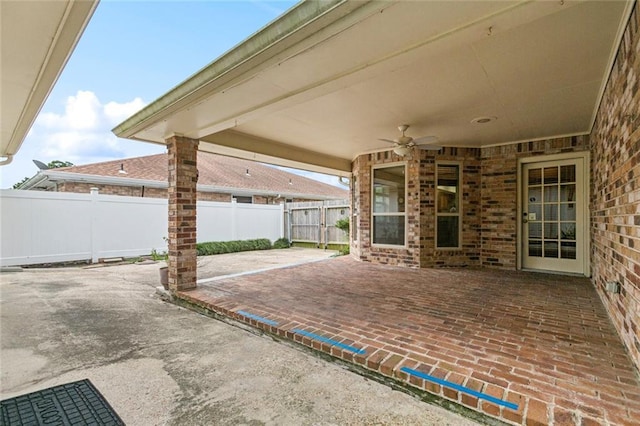 632 Brouilly Dr, Kenner, LA 70065 - fenced backyard with a ceiling fan and a patio