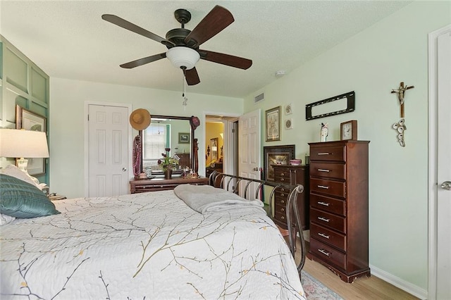 2704 Whitney Pl Unit 922, Metairie, LA 70002 - bedroom with light wood-style flooring and ceiling fan