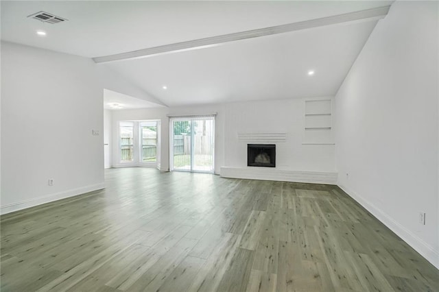1408 N Sugar Ridge Rd, La Place, LA 70068 - unfurnished living room with wood finished floors, a large fireplace, built in features, and recessed lighting