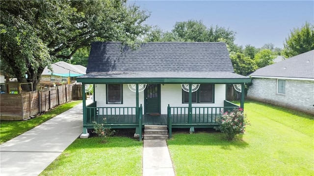 524 Camelia Ave, La Place, LA 70068 - view of front of home featuring roof with shingles, covered porch, and concrete driveway