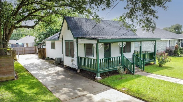 524 Camelia Ave, La Place, LA 70068 - bungalow-style home with a shingled roof, a porch, and driveway