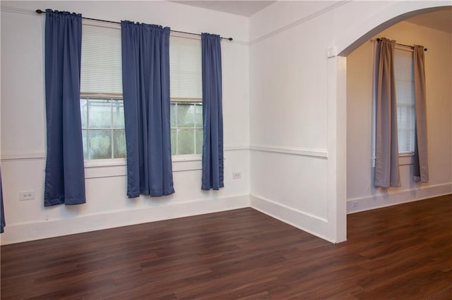 524 Camelia Ave, La Place, LA 70068 - empty room with arched walkways and wood finished floors