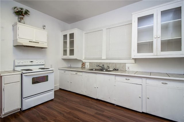 524 Camelia Ave, La Place, LA 70068 - kitchen featuring white range with electric stovetop, under cabinet range hood, white cabinets, dark wood-type flooring, and glass insert cabinets
