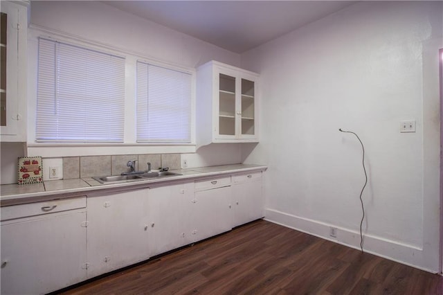 524 Camelia Ave, La Place, LA 70068 - kitchen with dark wood-style floors, light countertops, and white cabinets