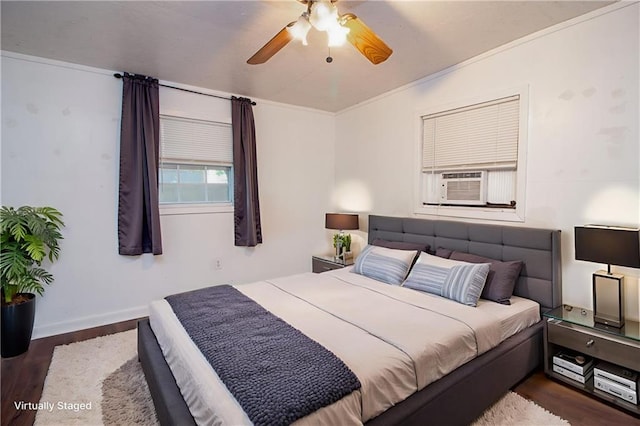 524 Camelia Ave, La Place, LA 70068 - bedroom featuring dark wood-style floors, crown molding, cooling unit, and a ceiling fan