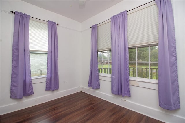 524 Camelia Ave, La Place, LA 70068 - empty room with dark wood finished floors and plenty of natural light