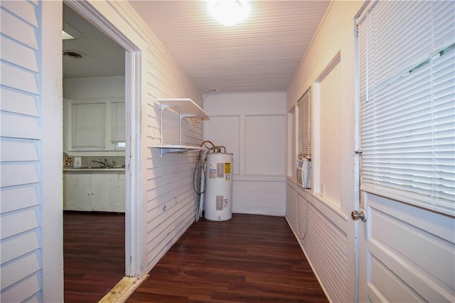 524 Camelia Ave, La Place, LA 70068 - corridor featuring water heater and dark wood-type flooring