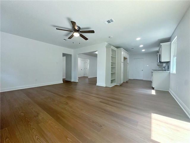105 Kempsey Ct, Slidell, LA 70458 - unfurnished living room featuring ceiling fan, dark wood-type flooring, and recessed lighting