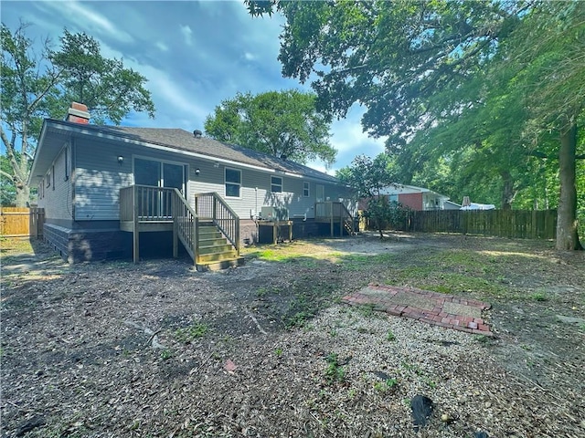 105 Kempsey Ct, Slidell, LA 70458 - back of house featuring a fenced backyard and a chimney