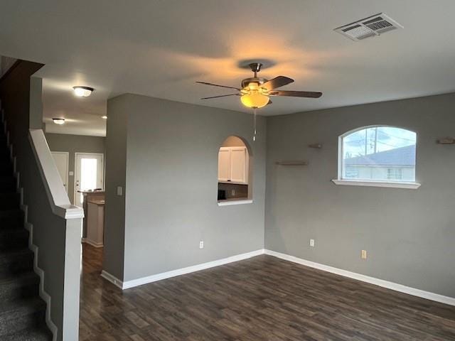 67 Carriage Ln Unit B, Destrehan, LA 70047 - spare room with a ceiling fan, dark wood-style floors, and stairway