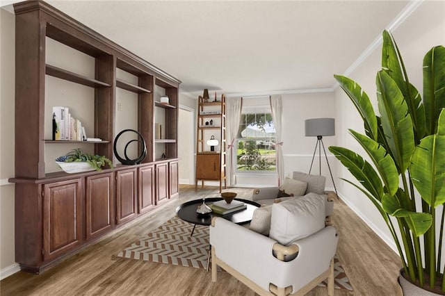 1524 Peach St, Metairie, LA 70001 - sitting room featuring light wood-style flooring and crown molding