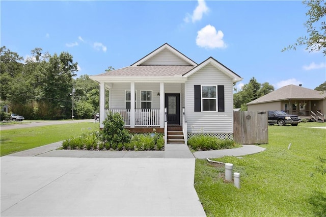 28794 Berry Todd Rd, Lacombe, LA 70445 - bungalow featuring a porch, a front lawn, and a shingled roof