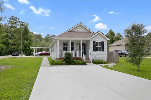 28794 Berry Todd Rd, Lacombe, LA 70445 - view of front facade featuring covered porch, a front lawn, concrete driveway, and a shingled roof