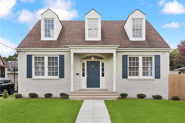 3222 Octavia St, New Orleans, LA 70125 - new england style home with brick siding and a shingled roof