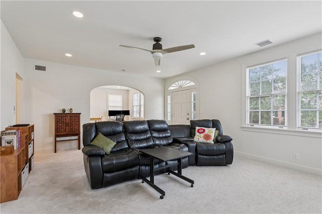 3222 Octavia St, New Orleans, LA 70125 - living room with light carpet, a ceiling fan, arched walkways, and recessed lighting