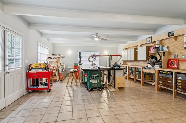 3222 Octavia St, New Orleans, LA 70125 - miscellaneous room with beam ceiling, light tile patterned floors, a workshop area, and ceiling fan