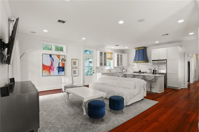 901 Henry Clay Ave, New Orleans, LA 70118 - living room featuring dark wood-style flooring and recessed lighting