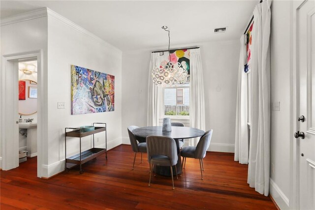 901 Henry Clay Ave, New Orleans, LA 70118 - dining area featuring wood-type flooring and crown molding