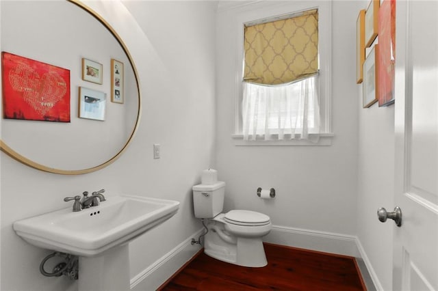 901 Henry Clay Ave, New Orleans, LA 70118 - half bathroom featuring baseboards and wood finished floors