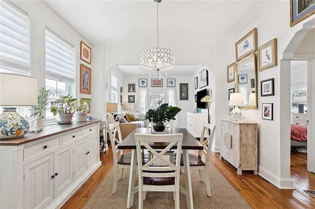 3116 Beaulieu St, Metairie, LA 70001 - dining room featuring hardwood / wood-style floors and a chandelier