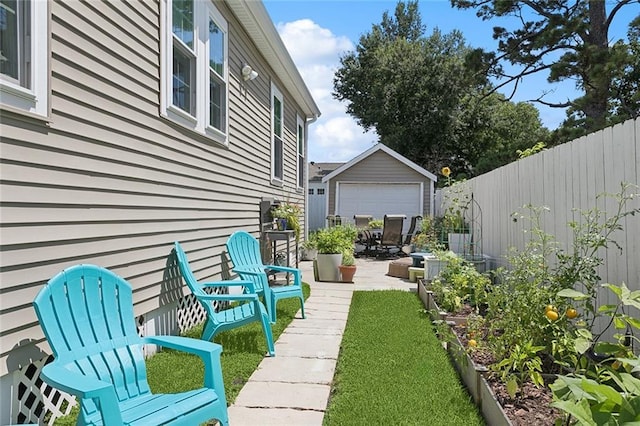 3116 Beaulieu St, Metairie, LA 70001 - view of yard with an outdoor structure, a vegetable garden, and a patio area