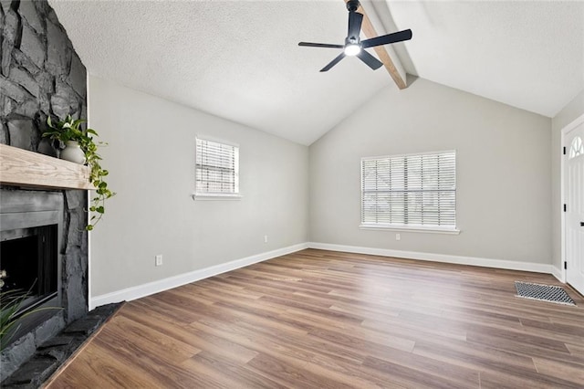 2306 Bluebird St, Slidell, LA 70460 - unfurnished living room with wood finished floors, a ceiling fan, and a fireplace