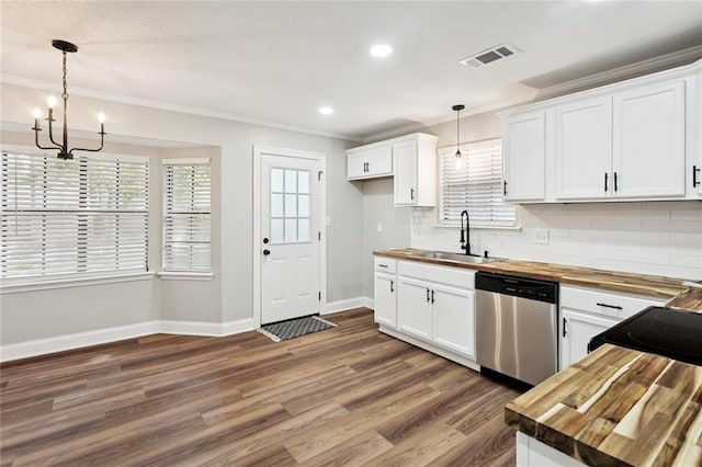 2306 Bluebird St, Slidell, LA 70460 - kitchen with wooden counters, dishwasher, dark wood-type flooring, crown molding, and a chandelier