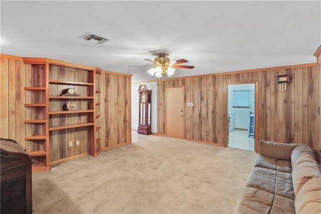2820 Metairie Ct, Metairie, LA 70002 - living area featuring a ceiling fan, carpet flooring, and wood walls