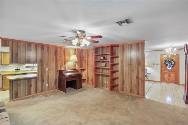 2820 Metairie Ct, Metairie, LA 70002 - living room featuring a ceiling fan, wood walls, and ornamental molding