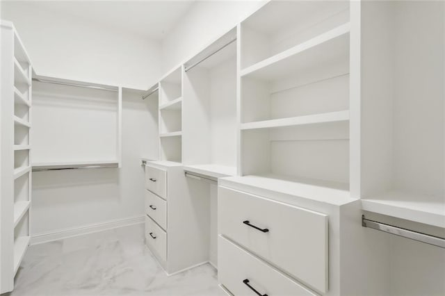2025 White Dove Dr, Madisonville, LA 70447 - walk in closet featuring light marble finish flooring