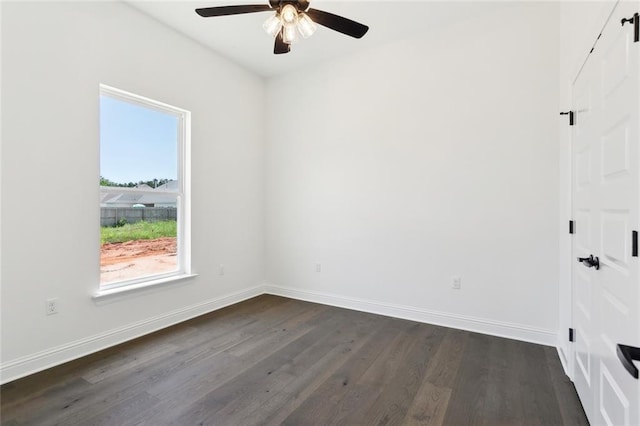 2025 White Dove Dr, Madisonville, LA 70447 - unfurnished room featuring dark wood-type flooring and a ceiling fan