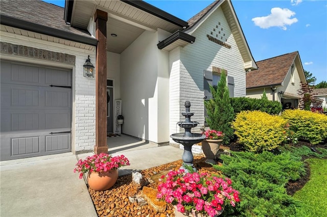 502 Terrace Lake Dr, Covington, LA 70435 - entrance to property with a shingled roof, brick siding, and a garage